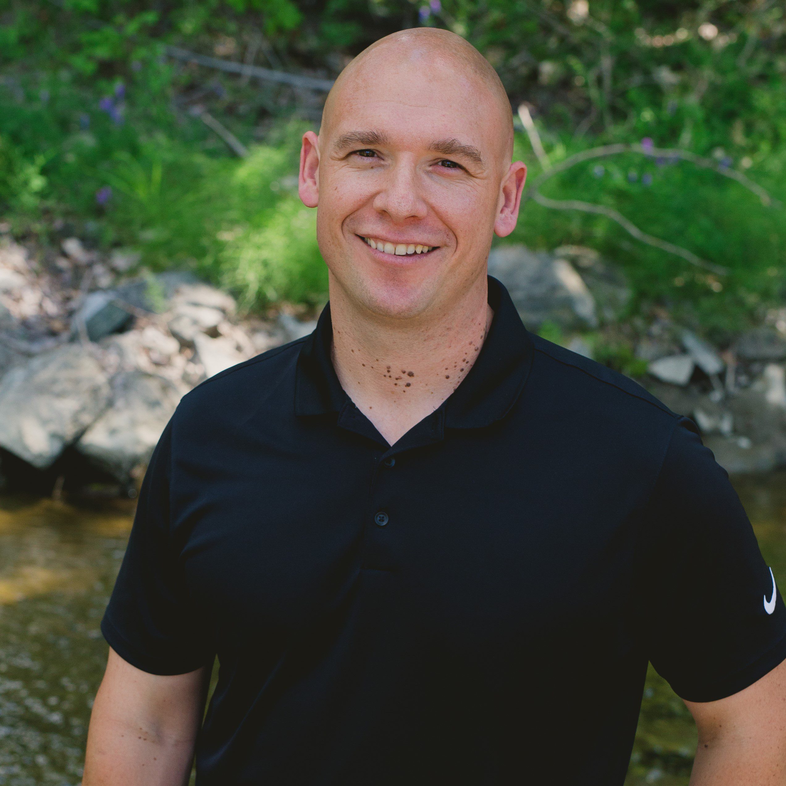 Chiropractor, Dr Ken Adams DC headshot in front of mission creek