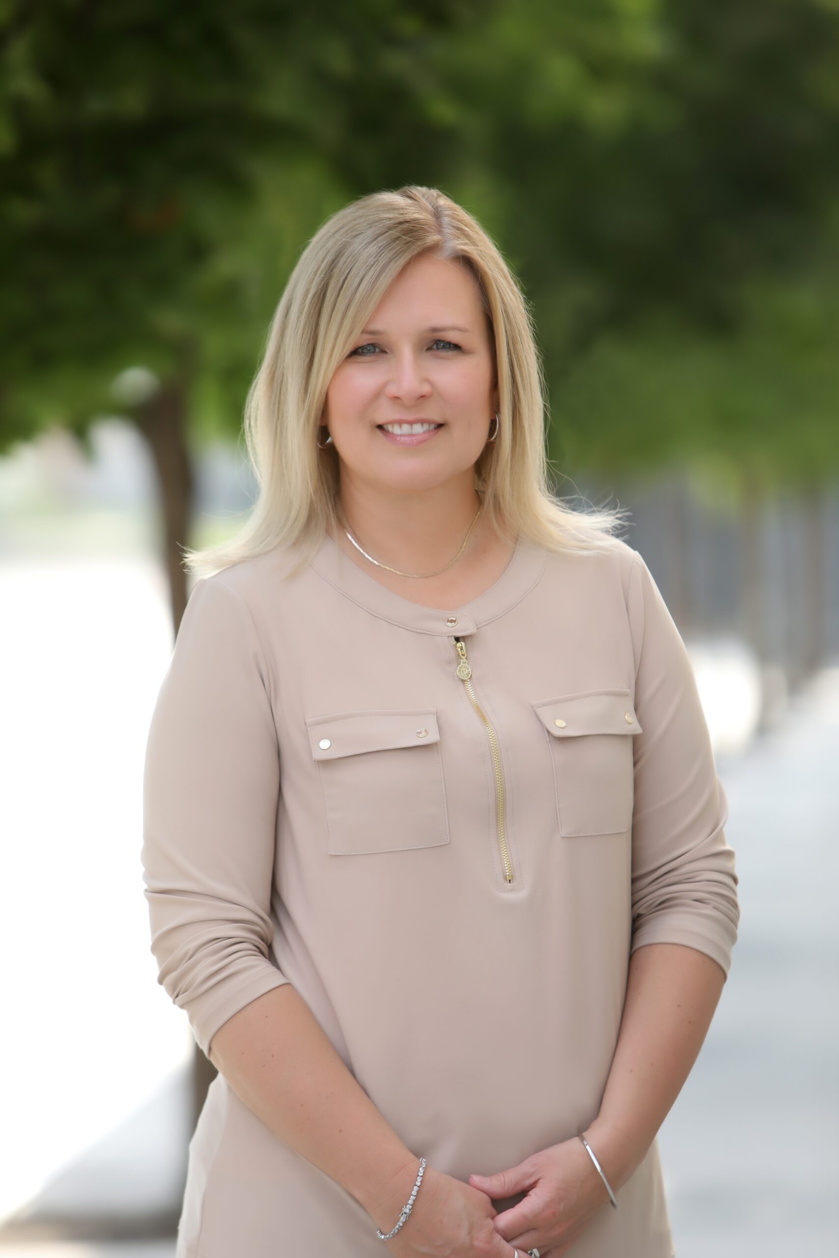 Operations Manager, Lee-Ann Tiede headshot with tree in background